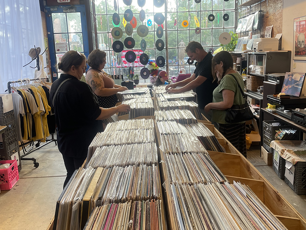 Customers enjoying vinyl shop 3